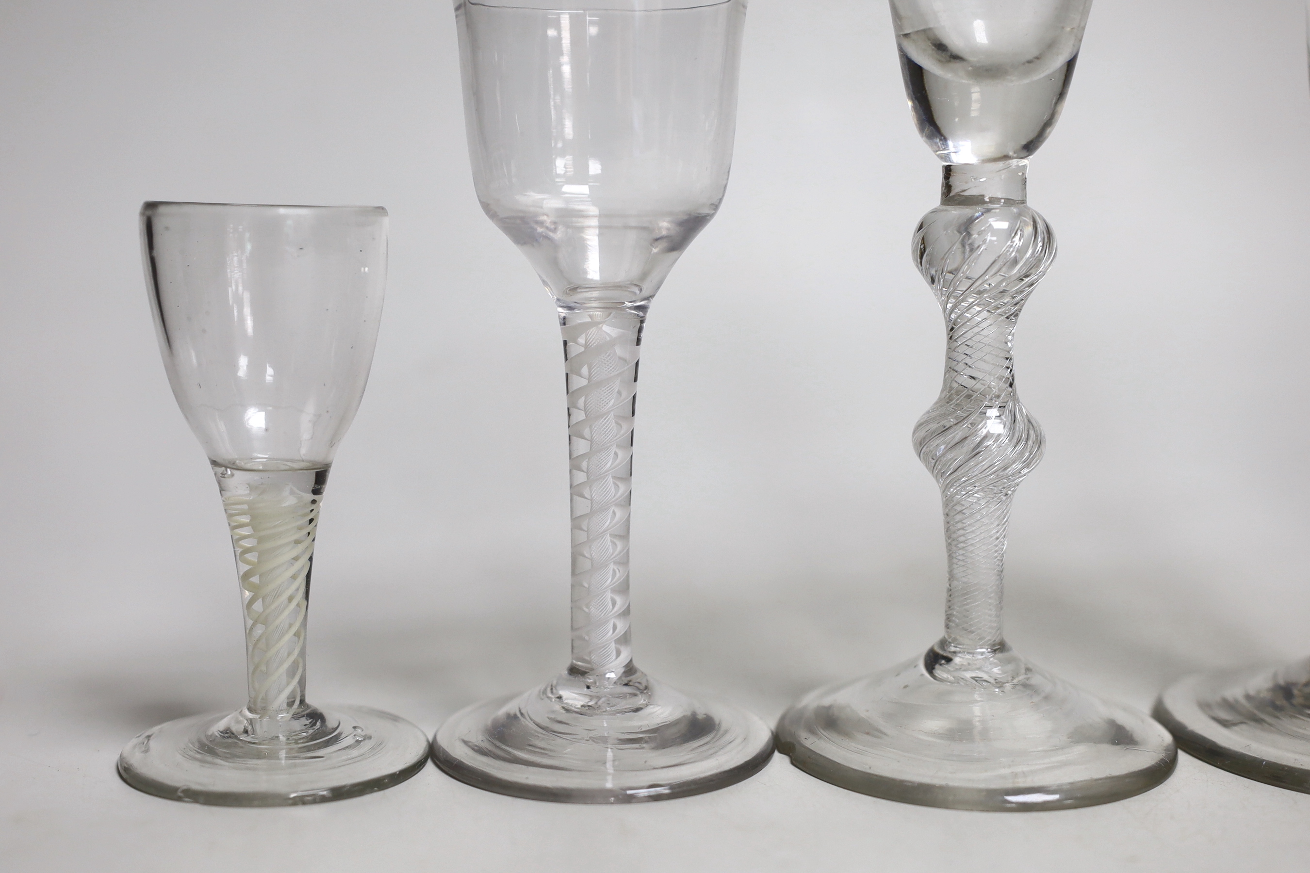 Two George II airtwist stem cordial or wine glasses, tallest 20cm high, a George III DSOT wine glass and two Continental DSOT glasses